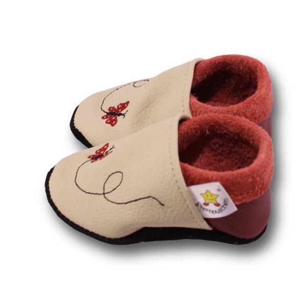 Krabbelschuhe Schmetterling im Flug auf beige